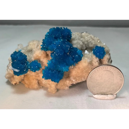 Vibrant blue cavansite and stilbite crystals on matrix from Pune, India