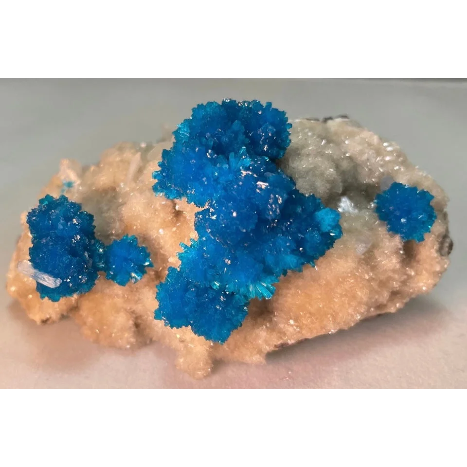 Vibrant blue cavansite and stilbite crystals on matrix from Pune, India