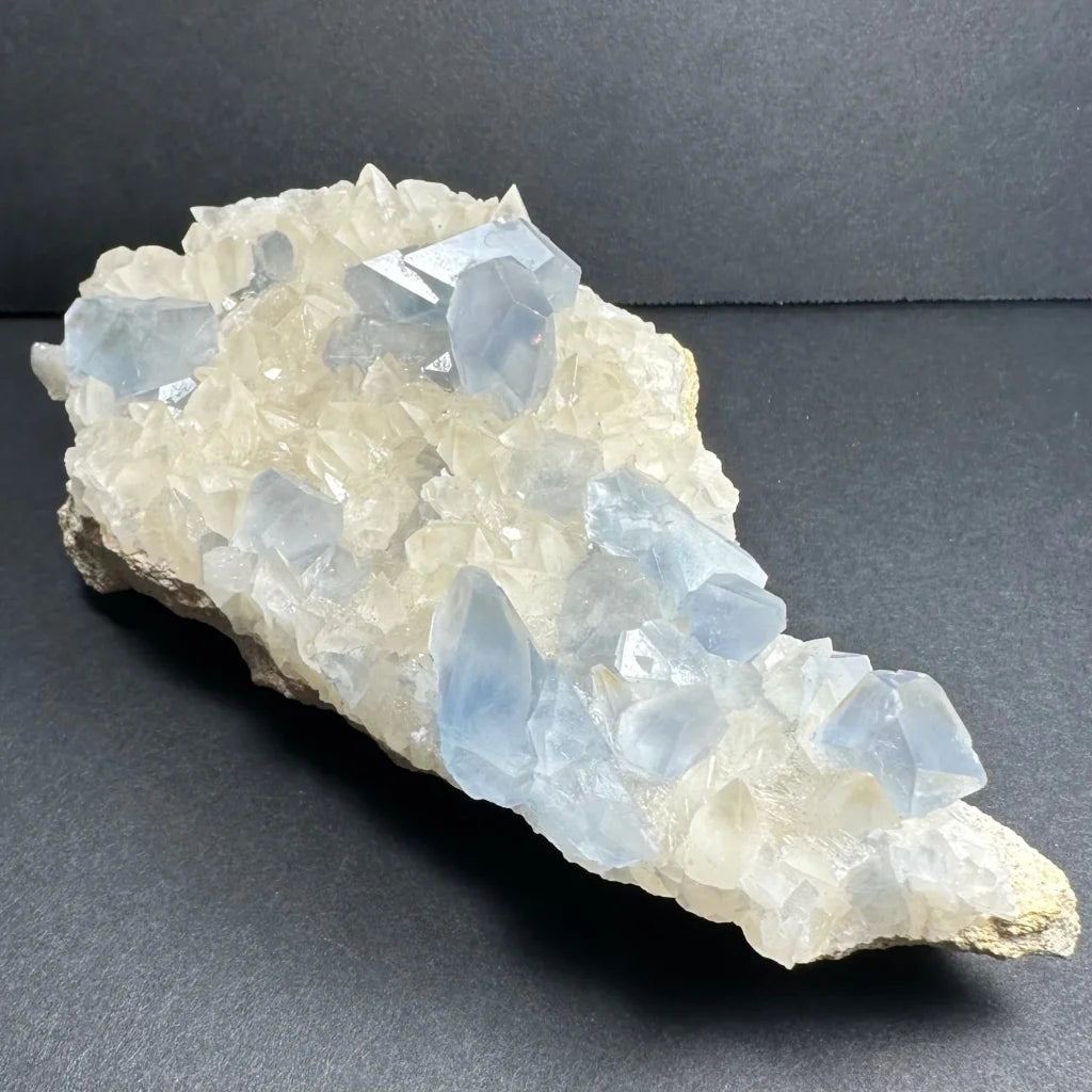 Stunning celestite crystals with dogtooth calcite on white matrix