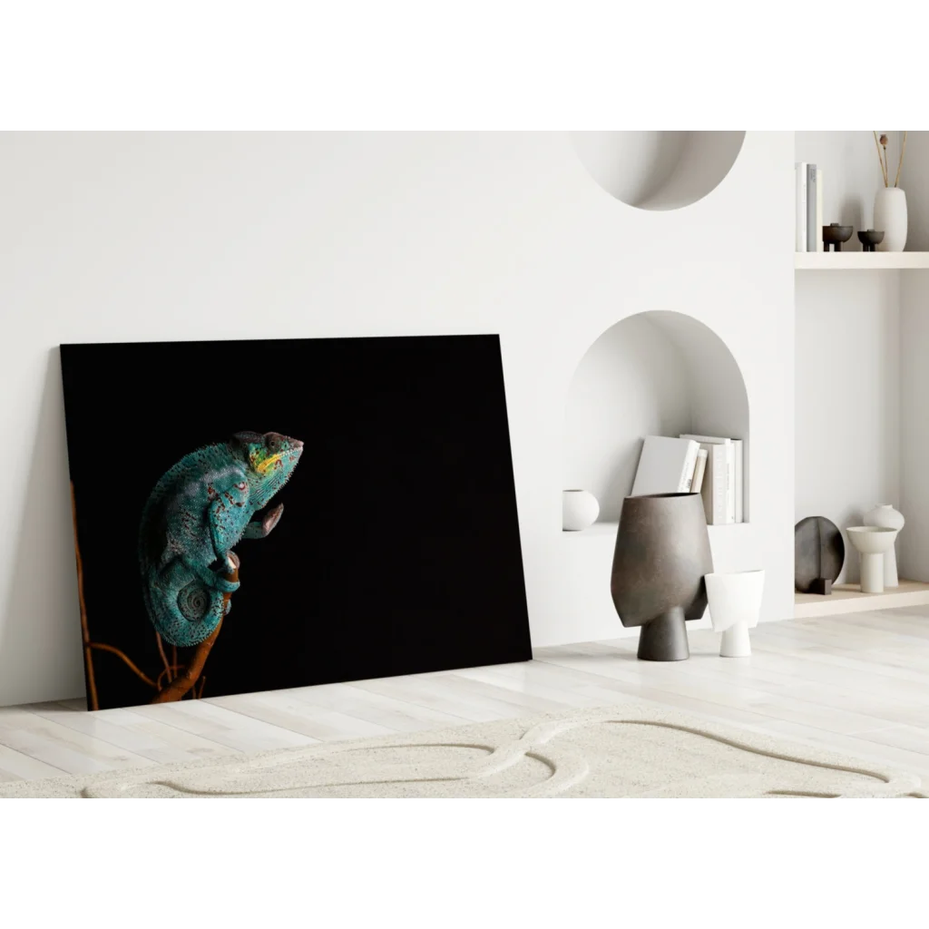 Vibrant teal chameleon glass wall art on black canvas
