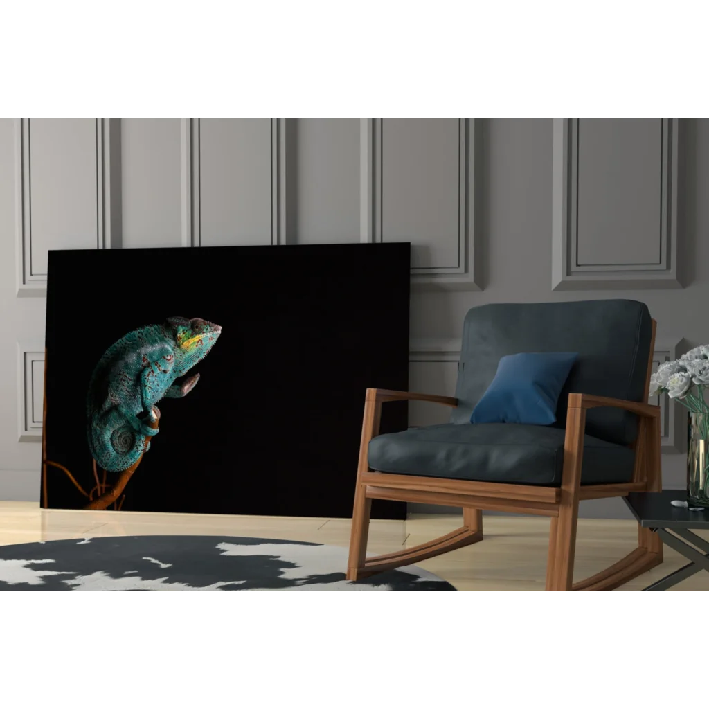 Vibrant teal chameleon glass wall art on black canvas