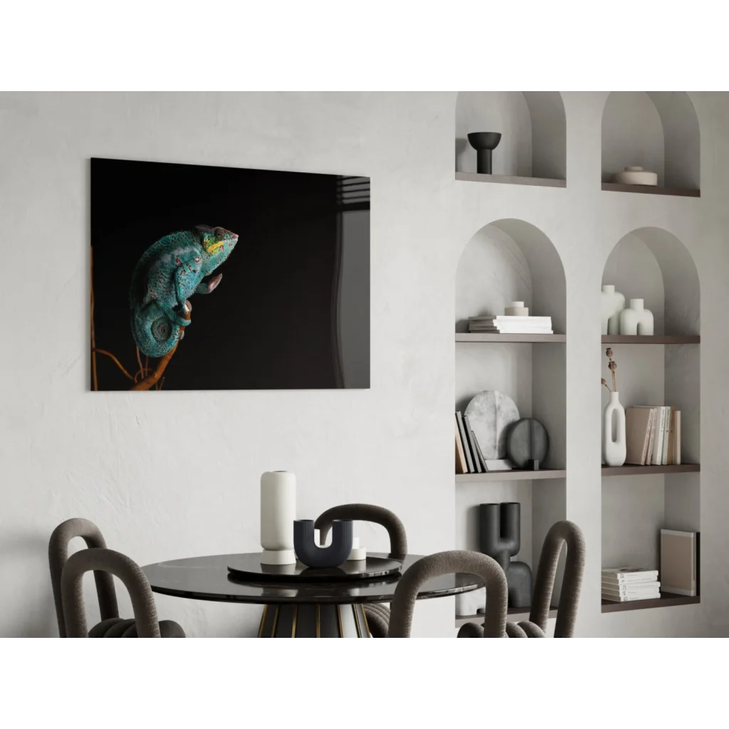 Vibrant teal chameleon glass wall art on black canvas