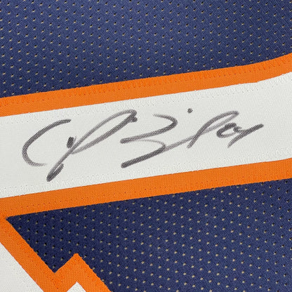 Autographed navy blue Broncos jersey with orange and white trim displayed with action photos