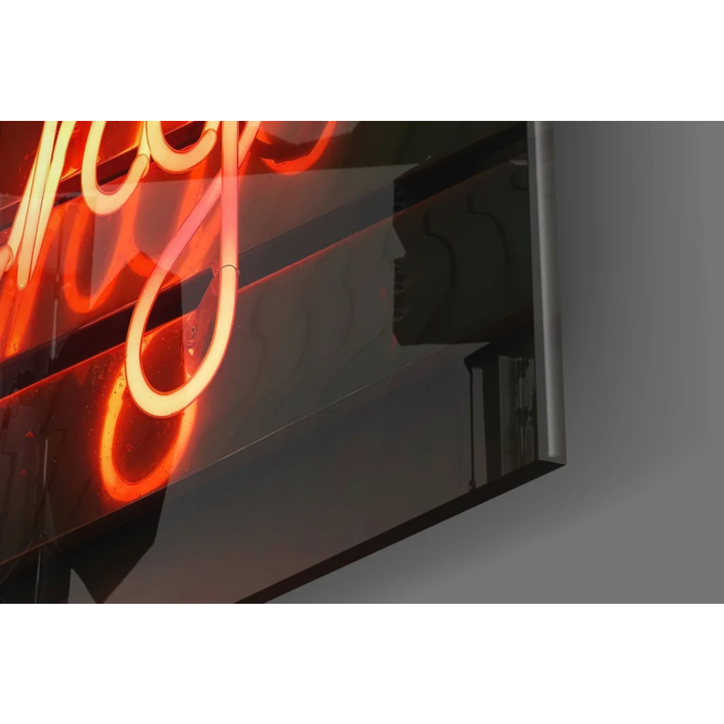 Glowing red neon cursive sign on dark reflective glass wall art