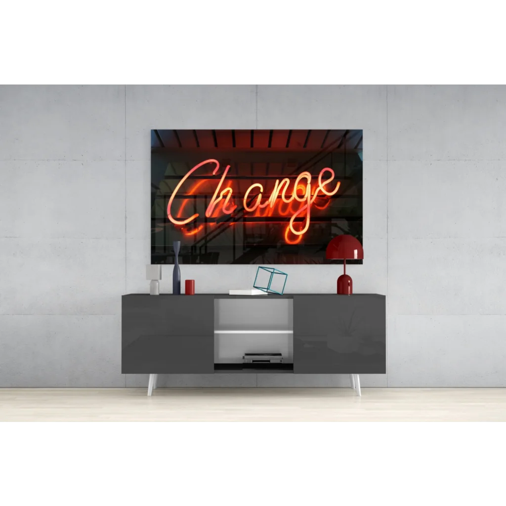 Glowing orange neon Change sign on pink glass wall art