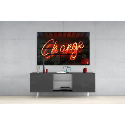 Glowing orange neon Change sign on pink glass wall art