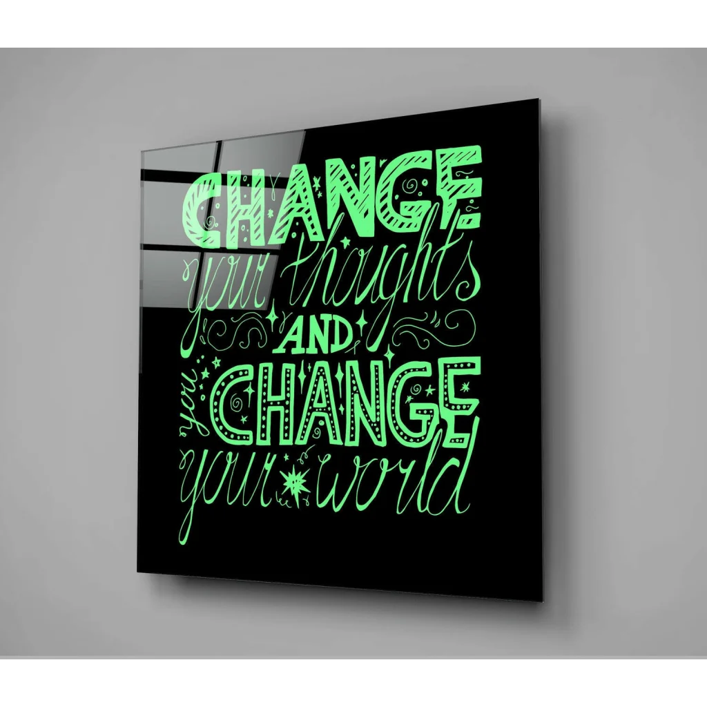 Sleek black glass wall art with neon green text: change your thoughts and change your world