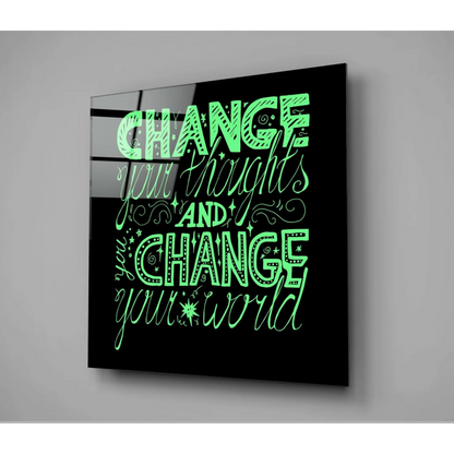 Sleek black glass wall art with neon green text: change your thoughts and change your world