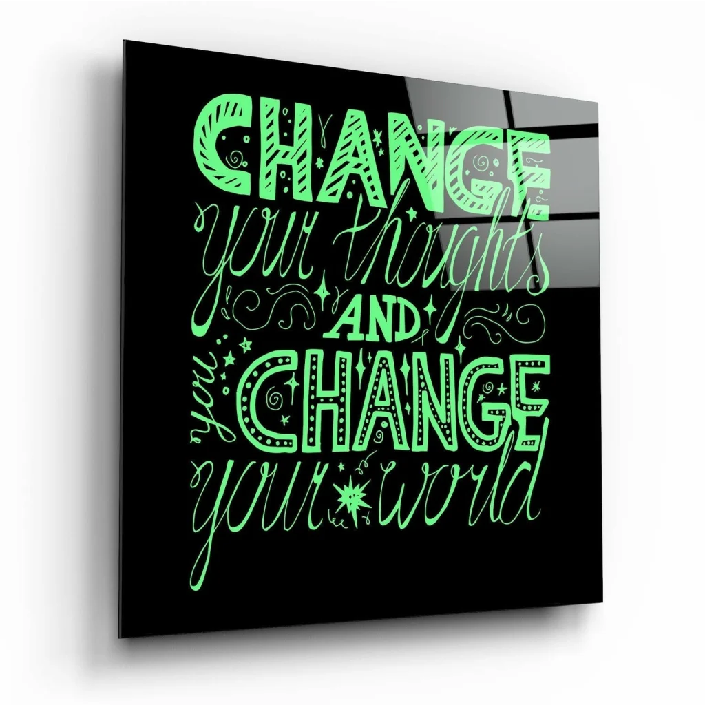 Glowing green motivational quote on sleek black glass wall art