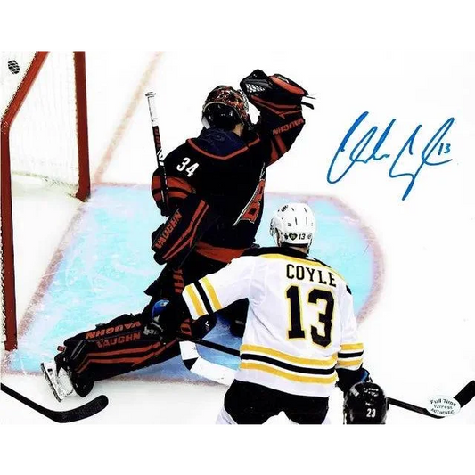 Autographed Boston Bruins photo of Charlie Coyle and teammate on the ice