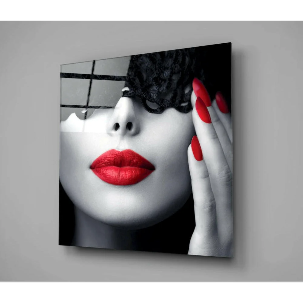 Striking black-and-white glass wall art of womans face with bold red lips and lace mask