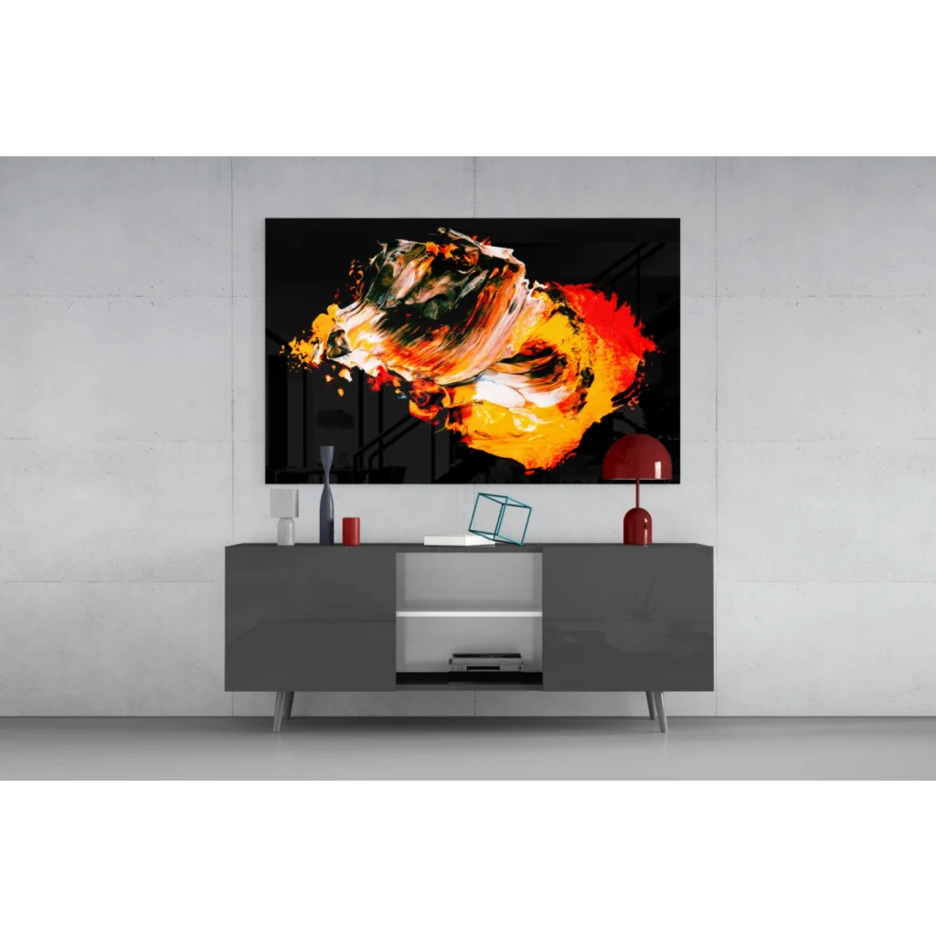 Vibrant fiery abstract wall art with bold orange red and green swirls on black canvas