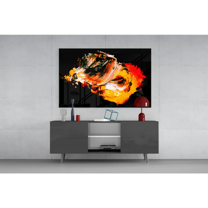 Vibrant fiery abstract wall art with bold orange red and green swirls on black canvas