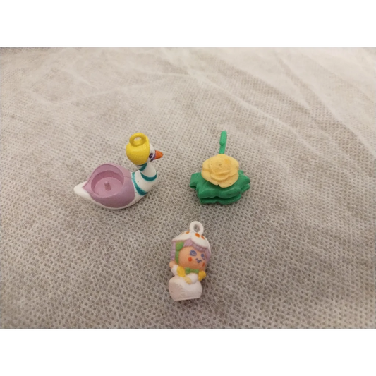 Vintage 1983 Hasbro Charmkins Twinkie Duck keychain with white body and yellow beak