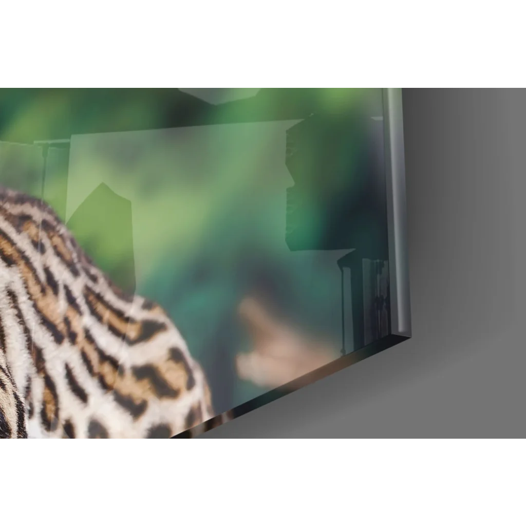 Sleek TV frame displays stunning ocelot glass wall art with golden eyes