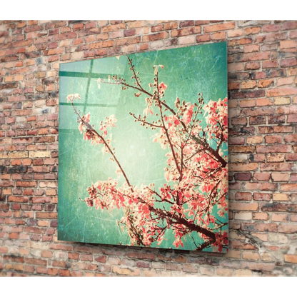 Vibrant pink cherry blossom tempered glass art on teal background