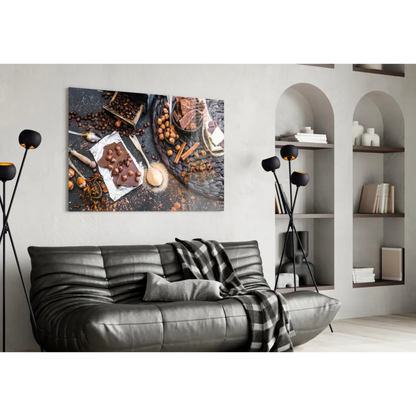 Black leather sofa with tufted cushions and plaid throw near glass wall art