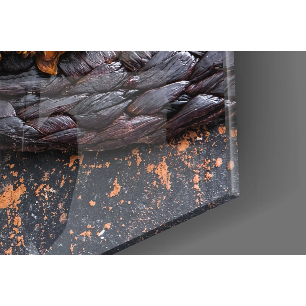 Rustic chocolate coffee glass wall art with dark braided glossy rope on speckled black surface