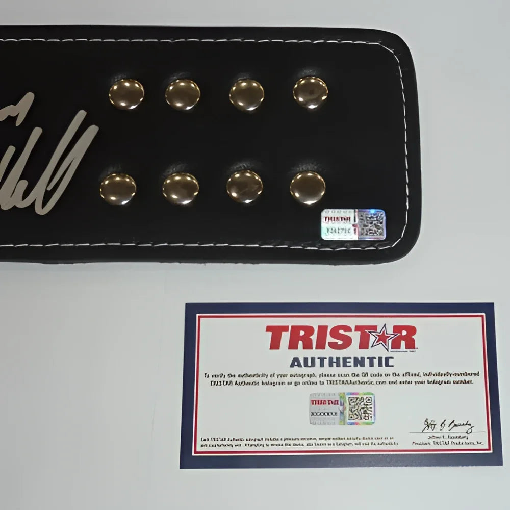 Black leather belt buckle with silver studs and chuck liddell autographed signature in white ink for ufc championship