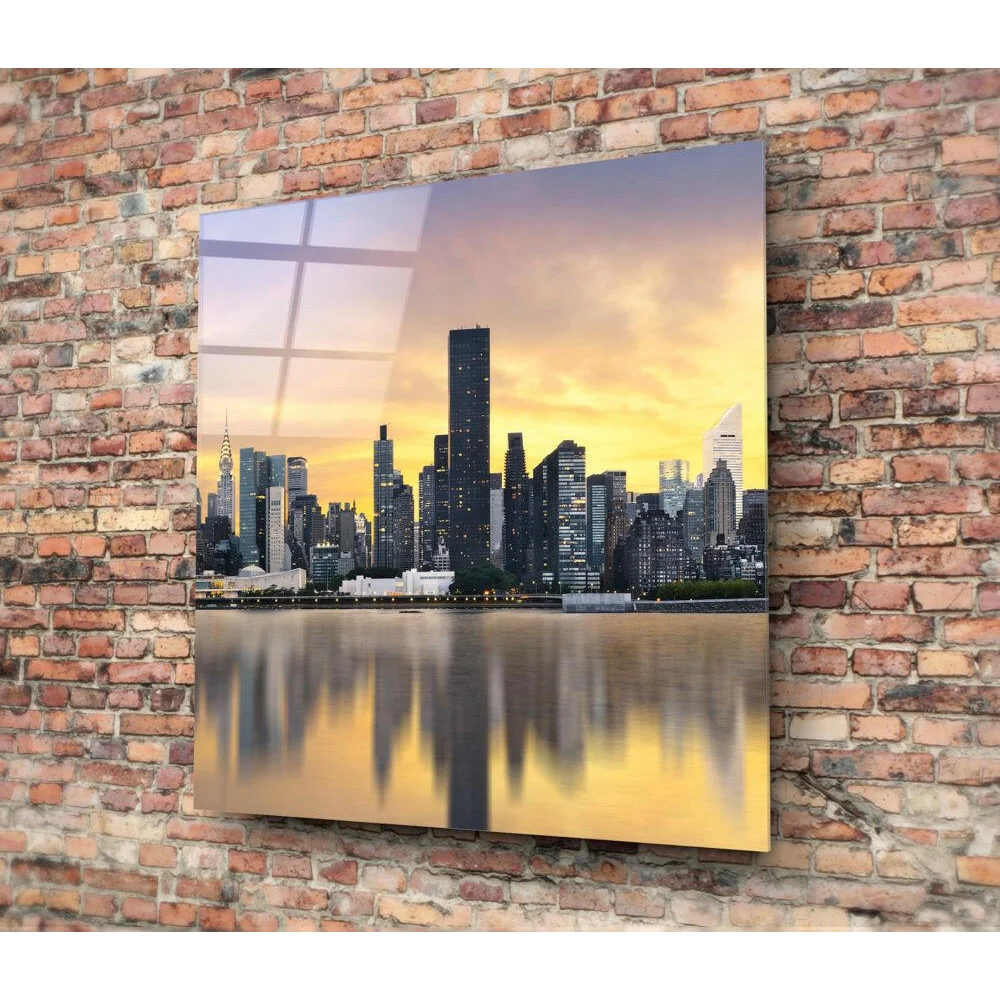 Vibrant sunset skyline glass wall art with golden reflections