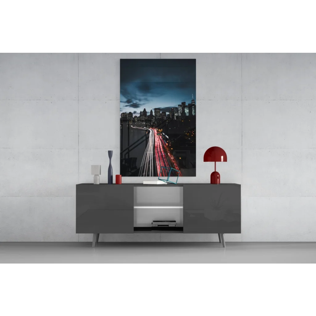Sleek gray sideboard with glossy minimalist design and glowing city lights glass wall art