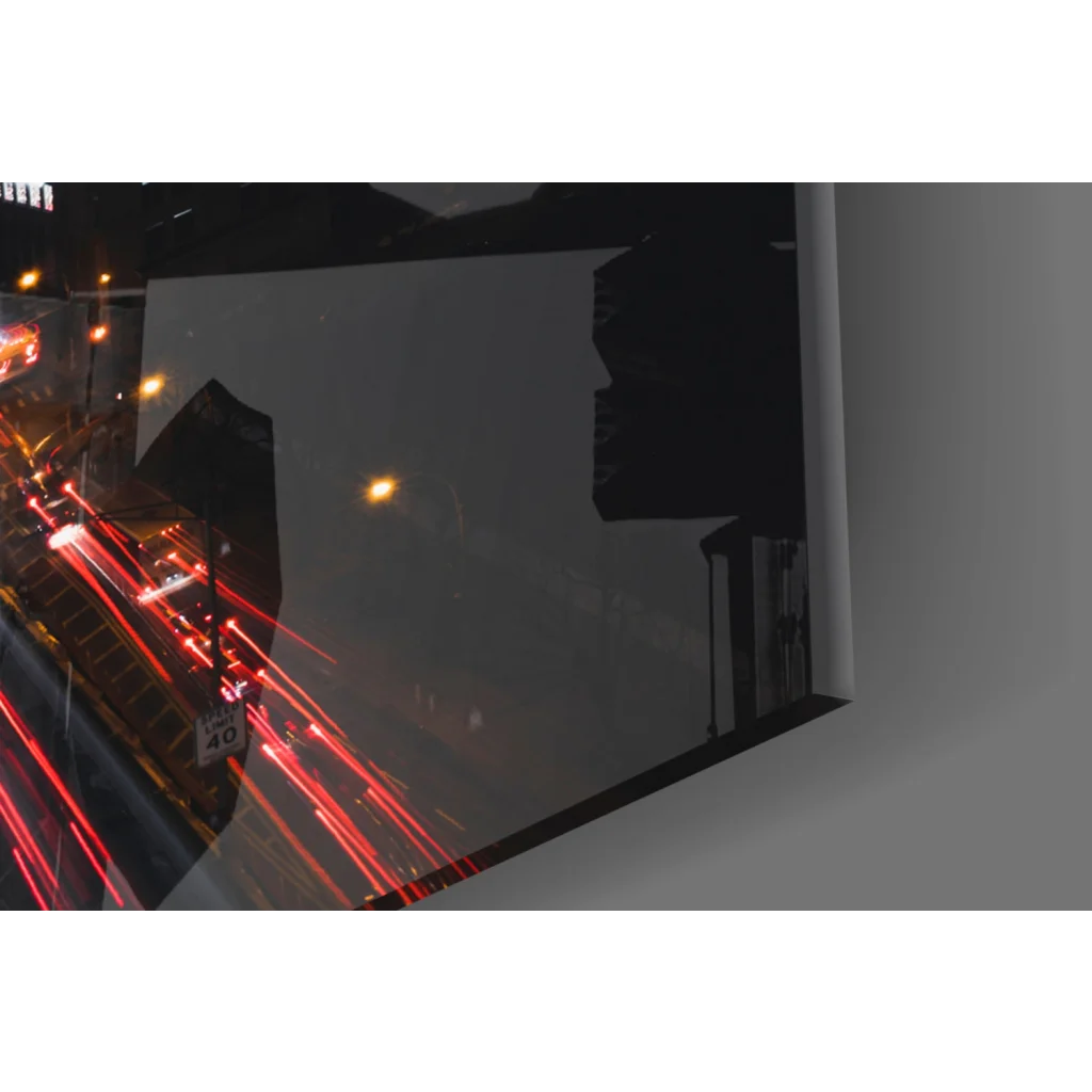Sleek black framed glass wall art of nighttime cityscape with red light trails