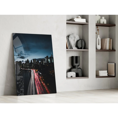 Sleek glass wall art of black-and-white cityscape with red light trails