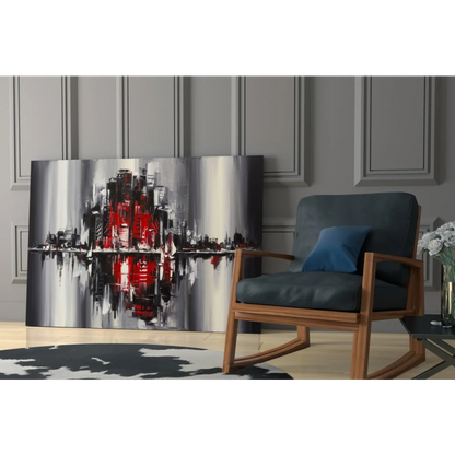 Abstract glass wall art of bold red, black, silver cityscape reflecting in water