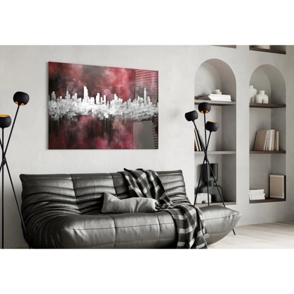 Black leather sofa with tufted cushions and plaid throw near urban skyline glass wall art