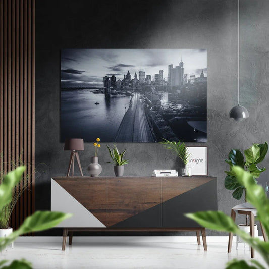 Black-and-white cityscape on brushed aluminium dibond, waterfront skyline with lights