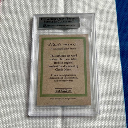 A graded collectible card featuring Claude Monet’s authentic handwritten document for sale