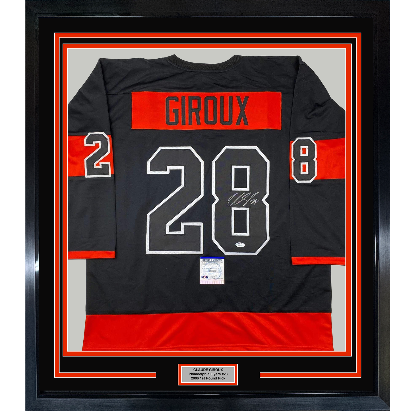 Framed black and red Philadelphia Flyers hockey jersey displaying "GIROUX 28" with signature, mounted in black frame with red borders and nameplate.