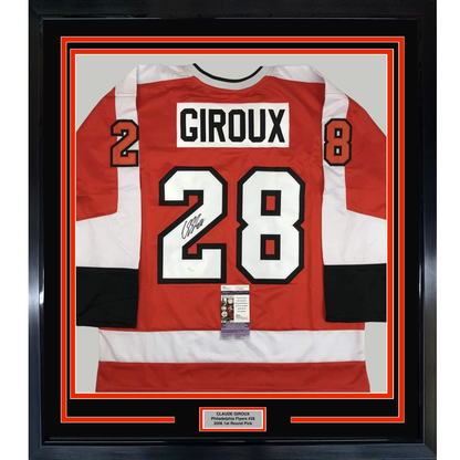 Framed red, white, and black Philadelphia Flyers hockey jersey signed by Claude Giroux, number 28, displayed front-facing with authentication certificate visible.