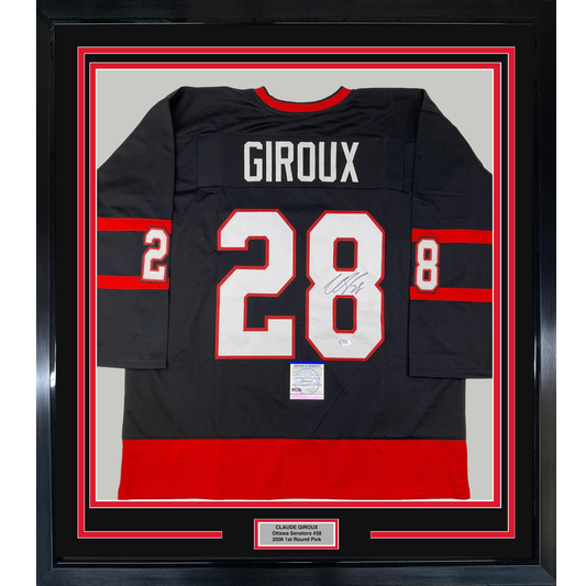 Framed black hockey jersey with red and white stripes displaying "GIROUX" and number 28, signed, with PSA authentication certificate visible below.