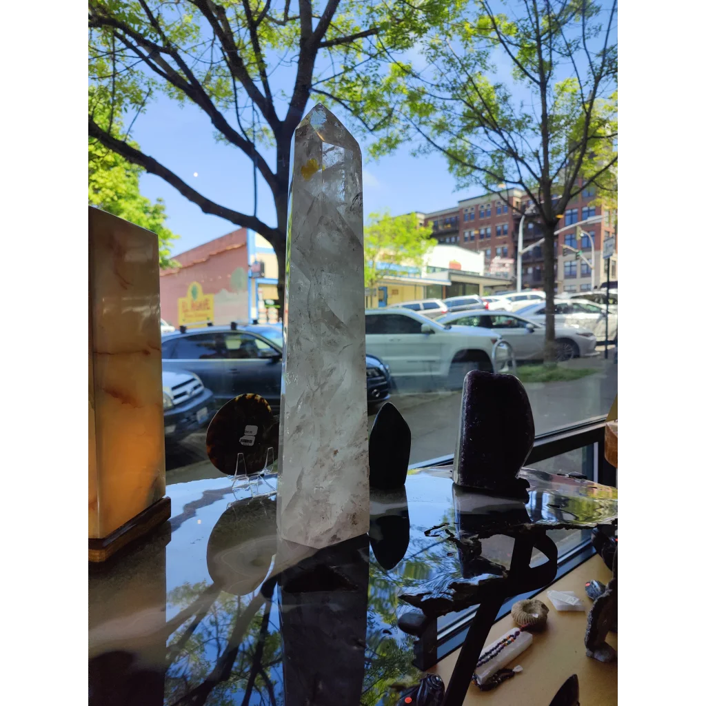 Clear quartz polished obelisk tower with translucent pointed top and natural internal inclusions weighing 5.35kg 17.5 inches tall