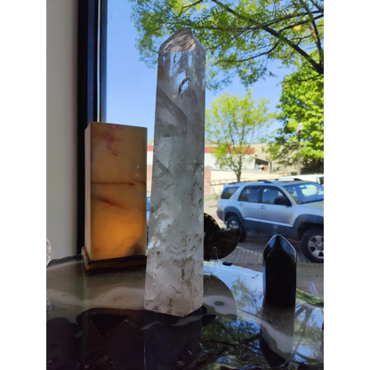 Clear quartz polished obelisk 5.35kg with natural inclusions and faceted top in clear quartz crystal point form
