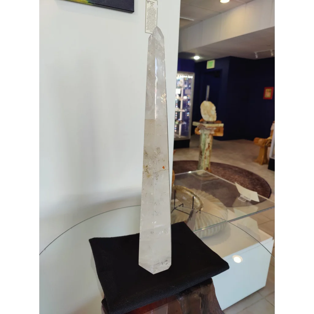 Clear quartz polished obelisk sculpture with natural inclusions and a smooth polished surface weighing 3.35kg and 20.5 inches tall