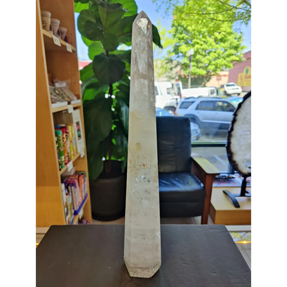 Clear quartz polished obelisk sculpture 20.5 inches tall with faceted top and natural inclusions weighing 3.35kg