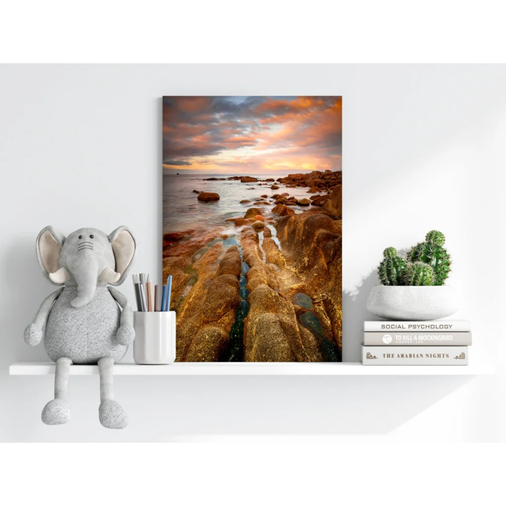 Stunning coastal sunset on insigne aluminum print with orange pink clouds and wet rocks