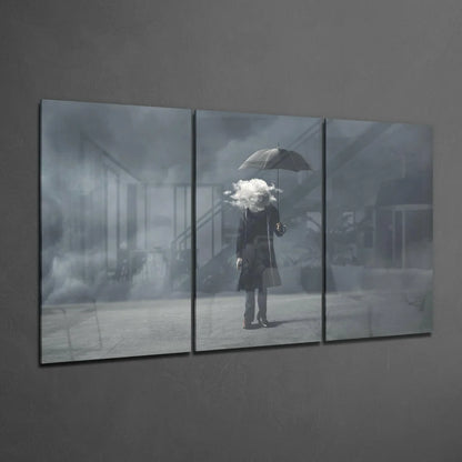 Rainy Day Dreamer glass wall art triptych with misty urban figure and umbrella