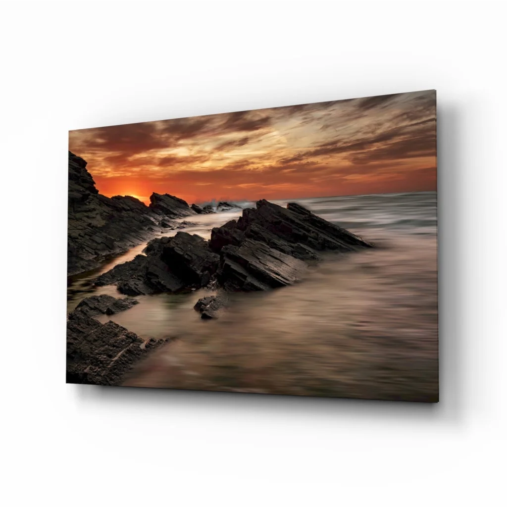Fiery Coastal Sunset Glass Wall Art Over Rugged Rocks | Insigneart USA | vintageantiquesgifts.com