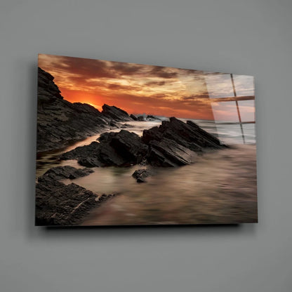 Fiery Coastal Sunset Glass Wall Art Over Rugged Rocks | Glass Wall Art Print | vintageantiquesgifts.com