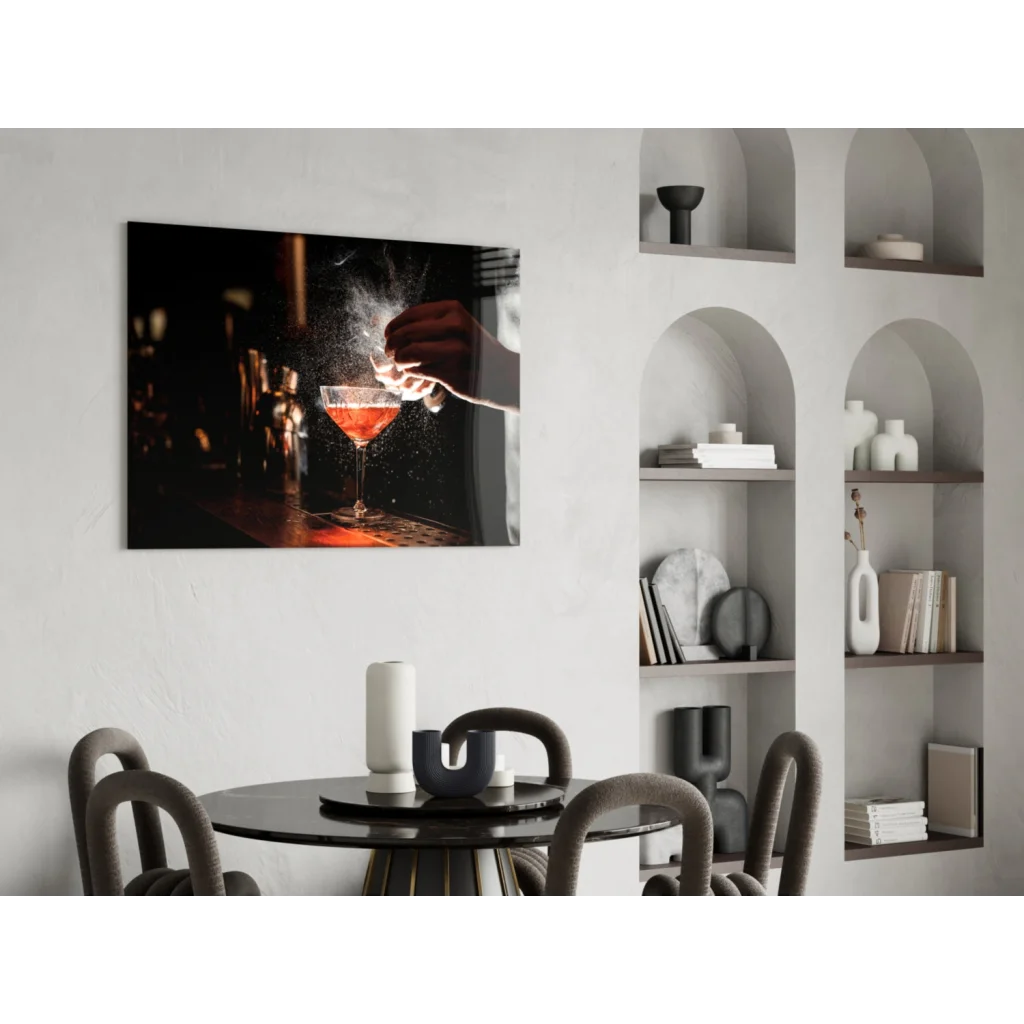 Black-framed cocktail glass wall art with hand pouring liquid and smoke