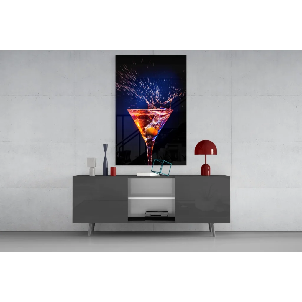 Vibrant orange cocktail splashing in martini glass wall art on black canvas
