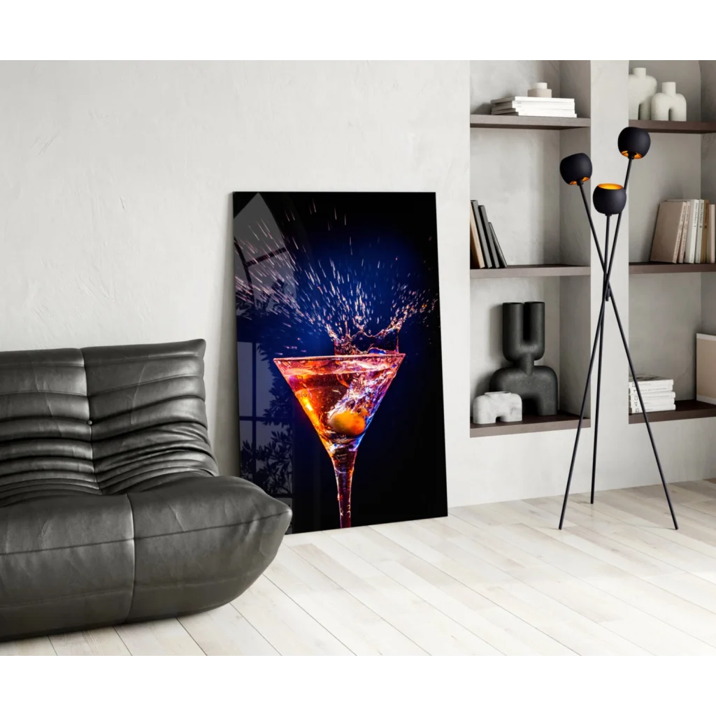Vibrant martini splash glass wall art canvas print with orange liquid and olive