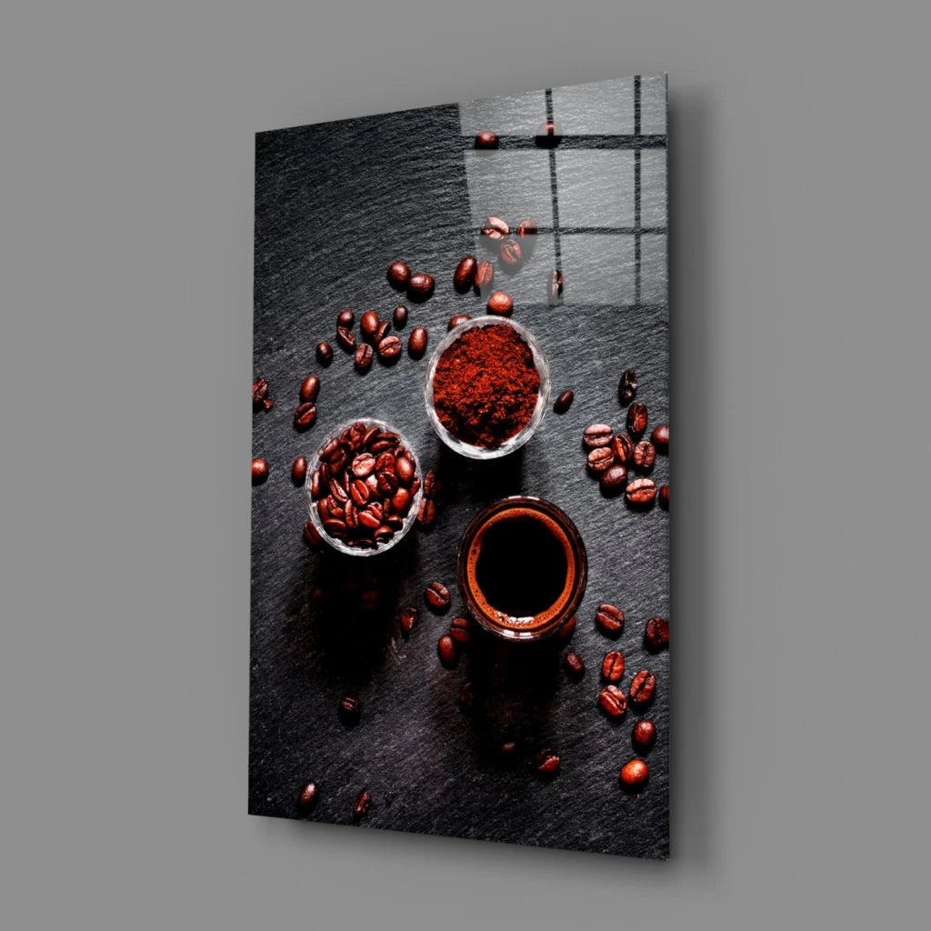 Sleek black glass wall art of coffee beans, grounds, espresso on slate