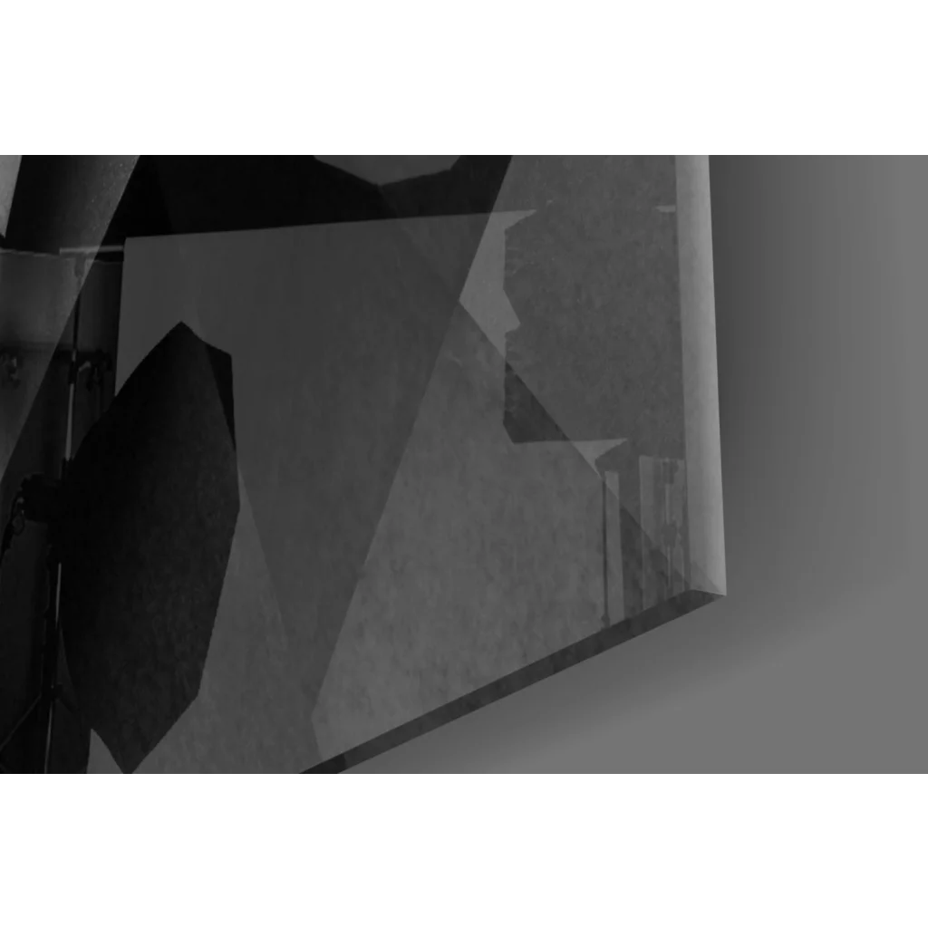 Sharp black geometric glass wall art with angular triangular facets