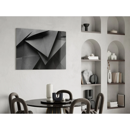 Sharp black geometric glass wall art with angular triangular design on canvas