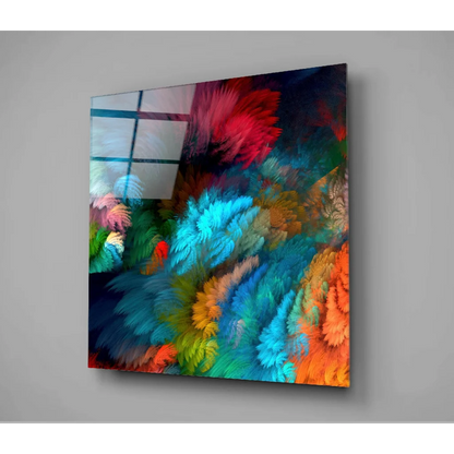 Vibrant swirling feather glass wall art in electric blues and fiery oranges