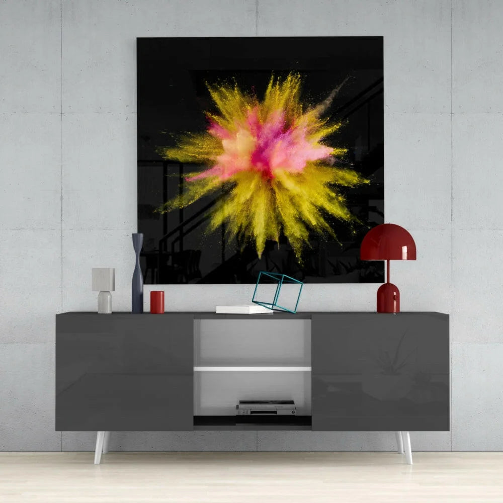 Vibrant pink yellow powder explosion on glass wall art black background